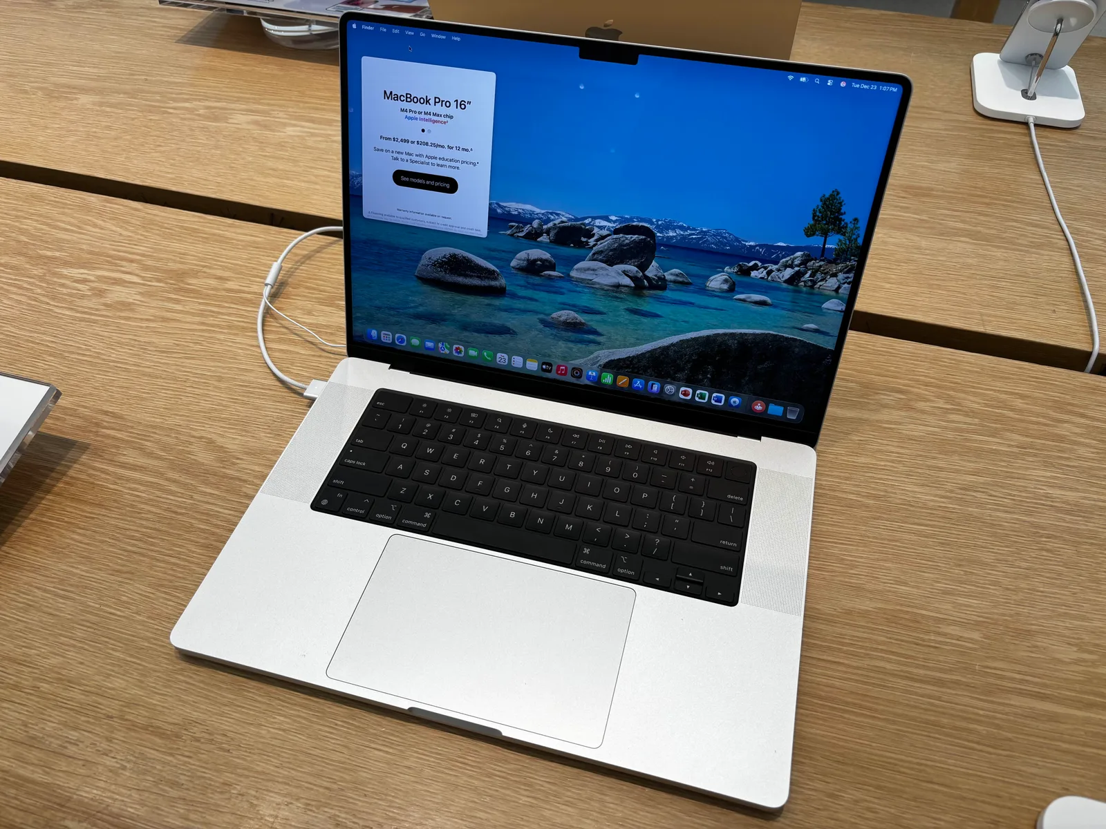 Silver 16-inch MacBook Pro with M4 Pro on a wooden table