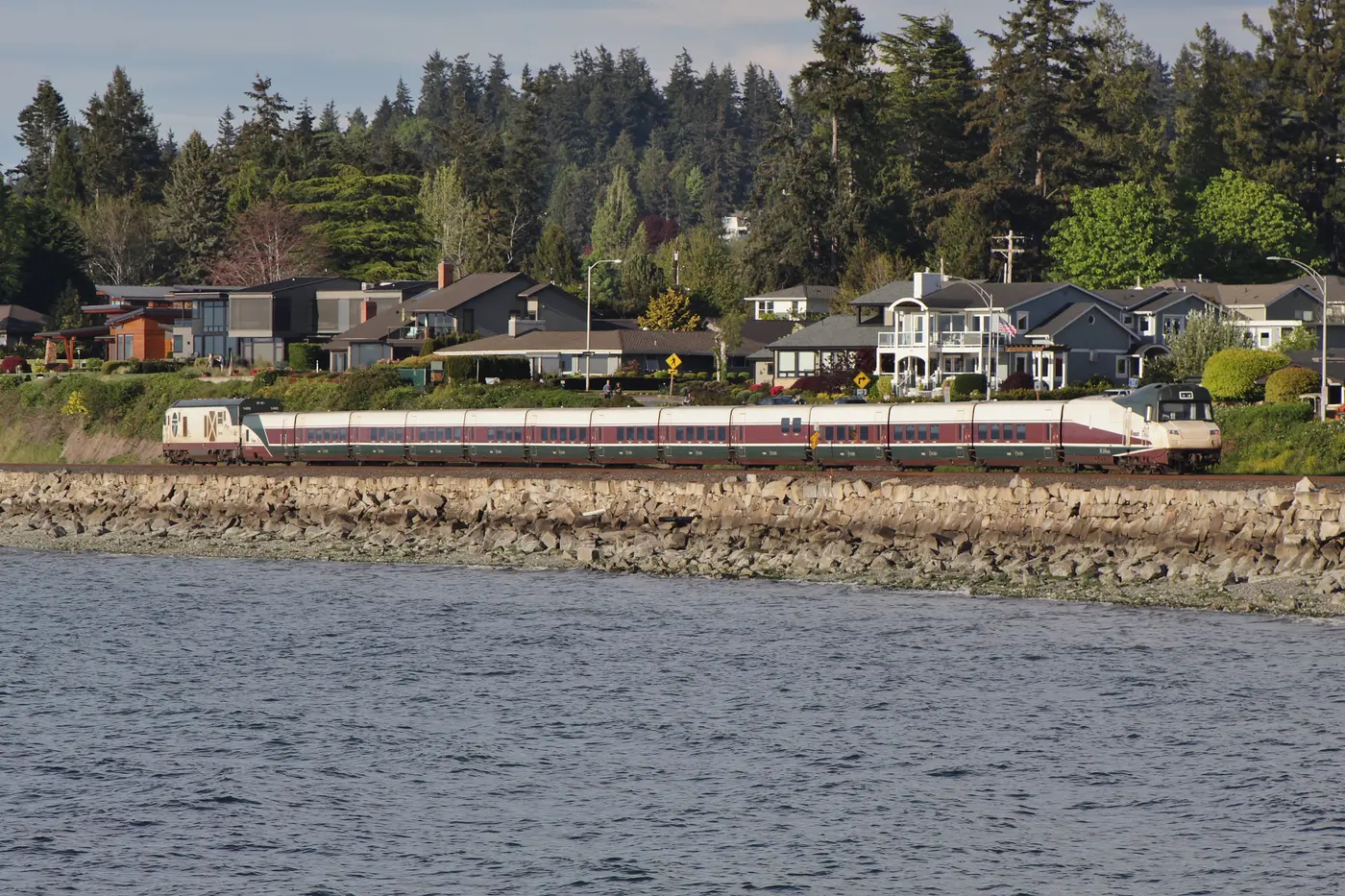 Amtrak Cascades train traveling along the waterfront in Edmonds, Washington